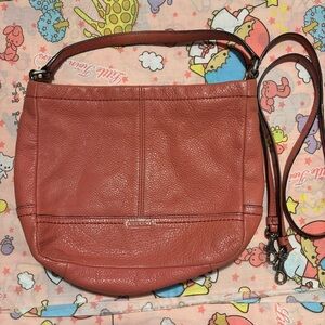 Coach leather crossbody in a warm peachy blush tone!